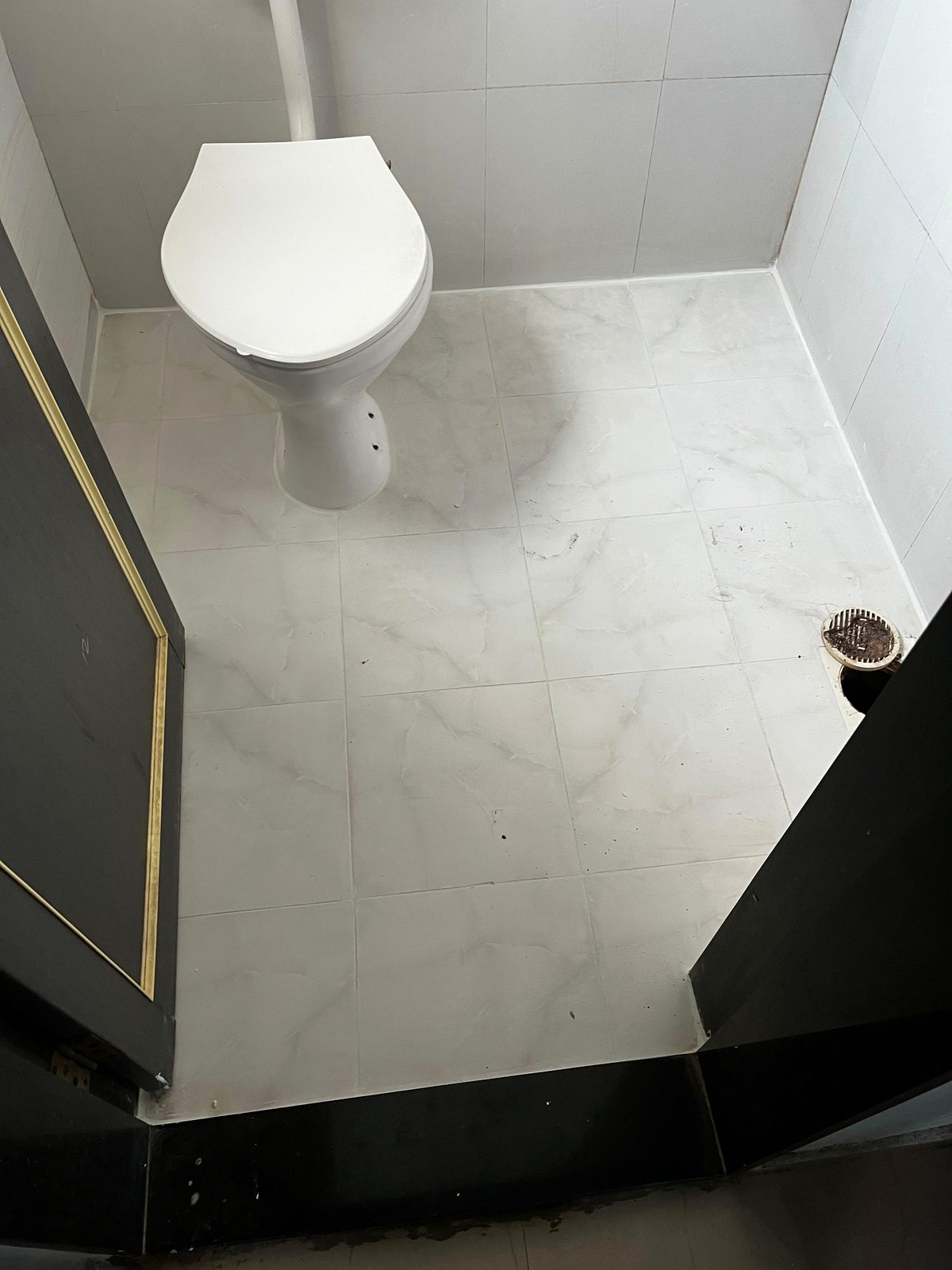 After waterproofing treatment: pristine protected bathroom tiles with zero tile breaking in Pune