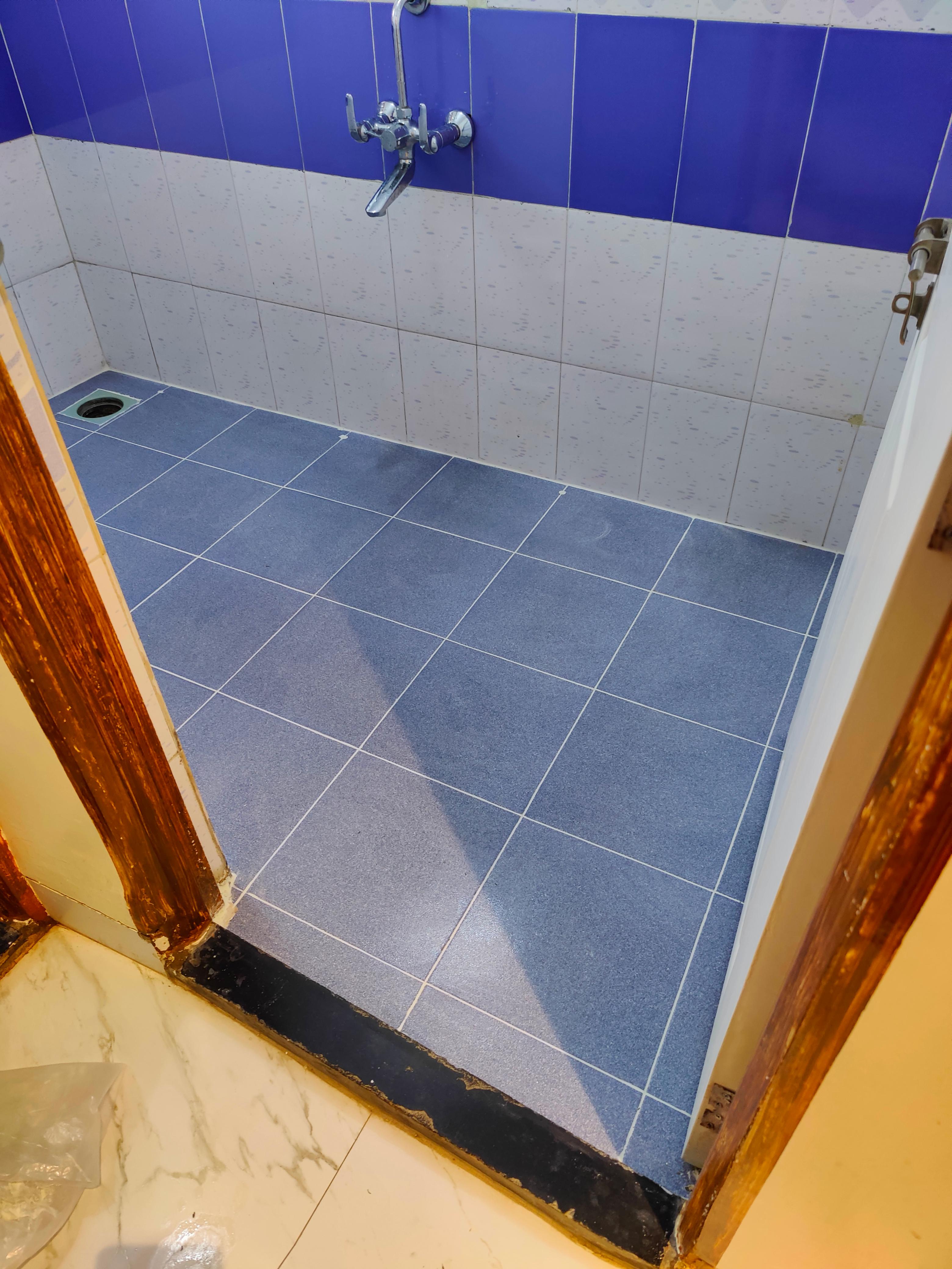Bathroom pressure injection grouting with zero tile breaking in Amanora Park Town