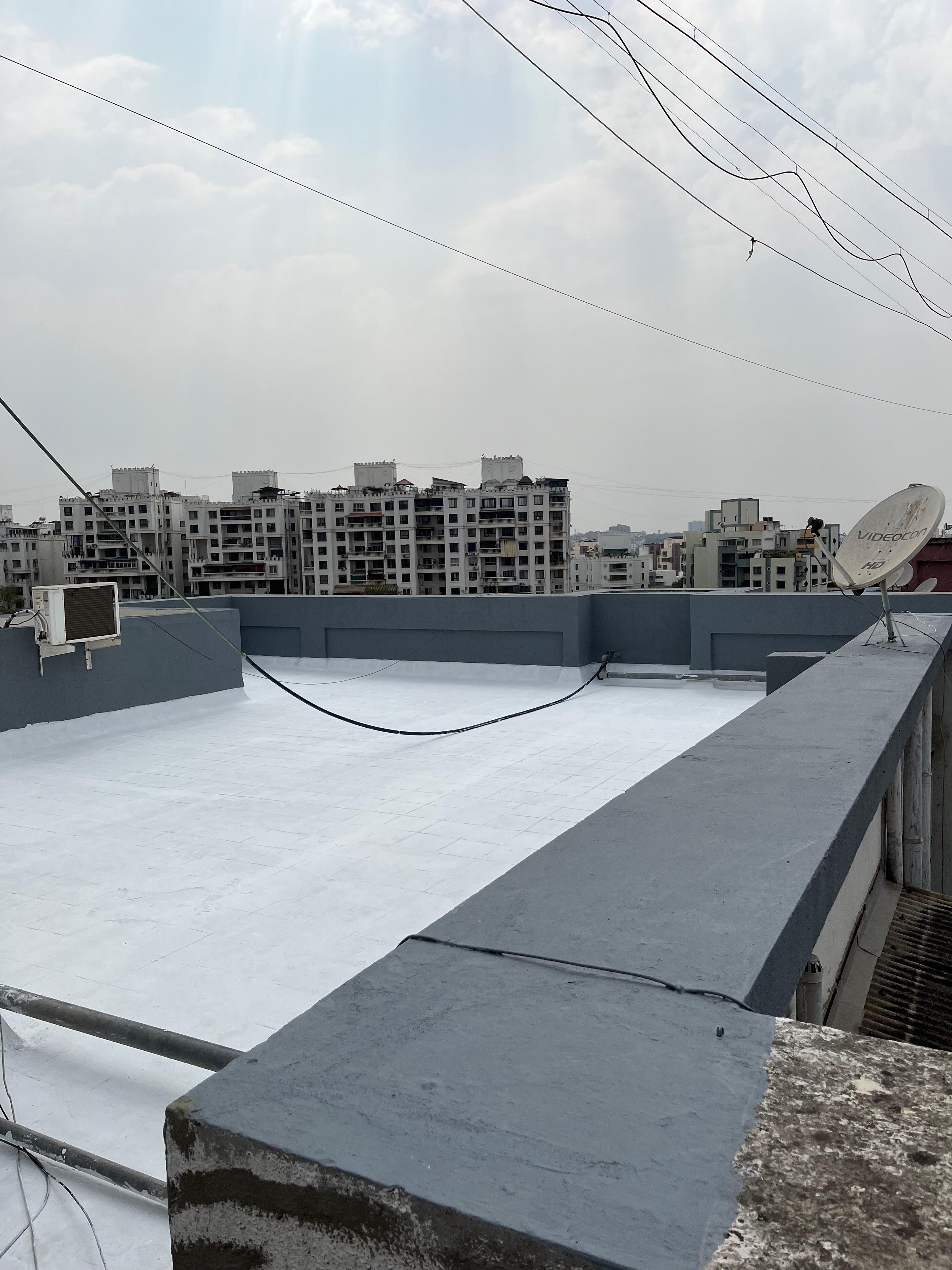 High-rise society terrace waterproofing and parapet wall sealing in Baner Pune
